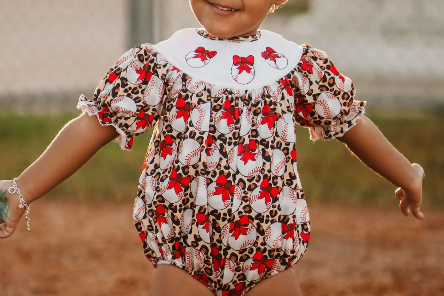 Smocked leopard baseball romper - Get it from Bo